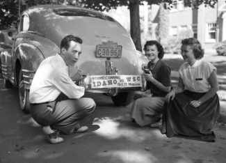 UI Library Special Collections | Courtesy
Students pose with homecoming bumper sticker in 1949. In the years following World War II, the University of Idaho experienced growth as students strived to return to more normal circumstances. Traditional college activities, such as homecoming, enjoyed renewed popularity.
