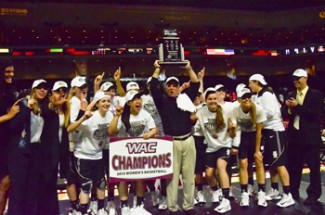 Theo Lawson | Argonaut Coach Jon Newlee hoists the WAC Championship trophy above the heads of his players who won Idaho's first conference championship since 1985.