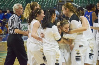 Theo Lawson | Argonaut Idaho players celebrate around Krissy Karr, who hit a buzzer beater to top San Jose State in the WAC Tournament quarterfinal round.