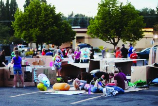 Alycia Rock | Argonaut Participants of the Cardboard Box City fundraiser for Family Promise of the Palouse gather in boxes in the Eastside Marketplace parking lot. The event raised money for Family Promise of the Palouse, as well as awareness of homelessness in the area.