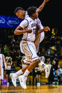 Philip Vukelich | Argonaut Idaho guards Mike Scott and Sekou Wiggs celebrate after the Vandal men's basketball team knocks off two-time Western Athletic Conference champions New Mexico State 73-67 Thursday in the Cowan Spectrum. Stephen Madison led Idaho with 24 points. 