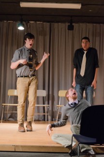 Members of the White Tie Improve group Kevin O'Connell, left, Micheal Angelo Smith, far right, and Cory Williamson, front, perform on Saturday in Shoup Hall. The Moscow Mardi Gras Comedy Show was co-hosted by the White Tie Improv group and the Comedy Lab.