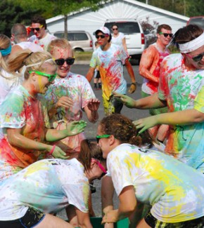 University of Idaho students and Moscow community members splash color cornstarch on each other at last year's Colors of Hope 5k run. All proceeds go to the Light a Candle program to support local cancer patients.