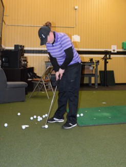 Hannah Sandoval | Argonaut Idaho sophomore Amy Hasenoehrl practices in the indoor putting room at the University of Idaho Golf Course on Feb 19. The Vandals open the 2014 fall season Monday at the Ptarmigan Fall Invitational at Fort Collins, Colorado.