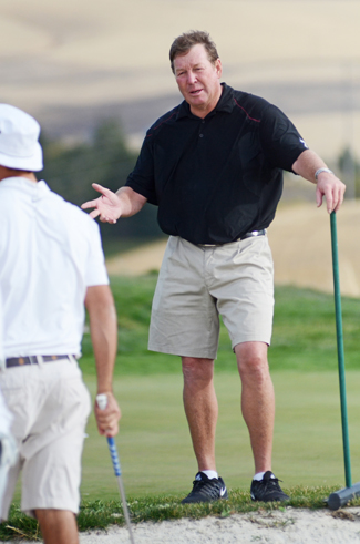 Men's golf coach John Means instructs team members during Wednesday's practice at the University of Idaho Golf Course. The team recently won the team title at the University of Wyoming Southern Invitational at  Ak-Chin Southern Dunes Golf Club in Phoenix, Arizona.