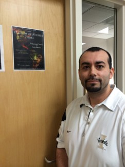 | Argonaut Jesse Martinez, Interim Director of the Office of Multicultural Affairs poses by the El Color de Nuestra Tierra filer