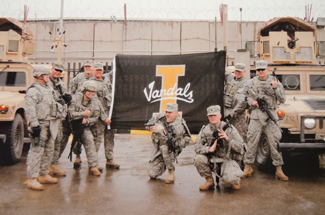 Nathan Romans | Argonaut A photo of troops holding a University of Idaho flag in Afghanistan hangs on the wall of the Veterans Assistance Office in the  Idaho Commons. 
