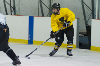 Nathan romans | Argonaut Forward Ian Nicoll looks to pass as he moves down the ice during Wednesday's prac- tice at the Palouse Ice Rink. The Idaho men's hockey club will play Washington State at 7 p.m. Saturday at the Palouse Ice Rink in Moscow.