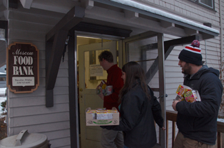 Jackson Flynn | Argonaut Senior Vandals from left to right, Tyler Foltz, Marissa Bourbonnais, and Max Kalicka donate to the Moscow Food Bank last Wednesday. It is located on 110 N Polk st. adjacent to the church. The Palouse Cares Food Drive will be taking place on Saturday.