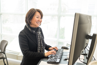 Philip Vukelich | Argonaut Jean Kim, vice provost for Student Affairs and Enrollment Management, works in her office Tuesday on the second floor of the Idaho Commons. Kim is the first to claim the title, as the role is newly defined after the retirement of previous UI Dean of Students Bruce Pitman.