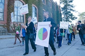 Nathan Romans | Argonaut UI adjunct faculty march in front of the Administration Building Wednesday to observe National Adjunct Walkout Day. Protestors sought to raise awareness of contingent faculty working conditions.