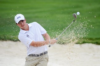 File Photo by Nathan Romans | Argonaut Senior Aaron Cockerill pitches out of the bunker during Tuesday's practice at Palouse Ridge Golf Club in Pullman. Cockerill finished tied for 14th overall at the Doc Gimmler Golf Tournament at Bethpage Red Course in Farmindale, New York. Idaho finished 3rd overall and will compete in the Itani Classic at Palouse Ridge Monday and Tuesday.