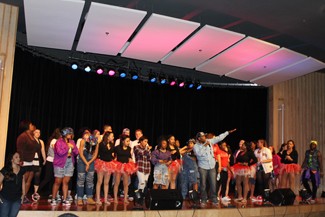Genie Tran | Argonaut All the performers in Shades of Black dance together during the final performance, including program creator and UI alumni Kwapi Vengesayi.