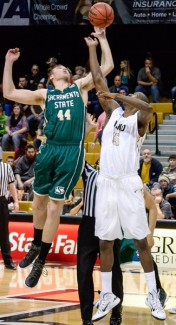 Amelia C. Warden | Argonaut Junior forward Paulin Mpawe reaches for the tip during Saturday's game against Sacramento State at the Cowan Spectrum. Idaho won 69-58 over the second-best team in the conference. 