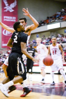 Jay Anderson | Argonaut Sophomore Gurad Sekou Wiggs getting blocked by Eastern's Venky Jois during Saturday's 98-95  loss to Eastern Washington.