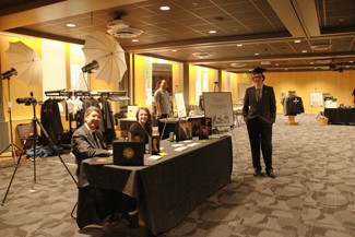 Yishan Chen | Argonaut Ron Dingman, Sarah Barnish and Ryan Wagner wait for students to get photographed during GradFest on Monday, Dingman (left) is a professional photographer from Portland, Oregon.