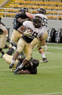 Nathan Romans | Argonaut Sophomore runningback Aaron Duckworth breaks a tackle during practice Saturday in the Kibbie Dome.