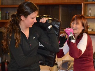 Amelia C. Warden | Argonaut Alex Albert (left) and and Jae Bryan (right) being a 1, 2 punch combo defense tactic move during the Krav Maga class at Moscow Defensive Tactics on Monday evening.