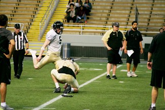 Nate Mattson | Argonaut   Junior Austin Rehkow kicks a field goal to put up an extra point during Friday night's Silver and Gold game at the Kibbie Dome.