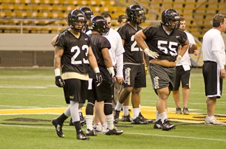 File photo by Nathan Romans | Argonaut Senior linebacker Marc Millan, left, prepares for the next play during the first spring practice of the year March 25 in the Kibbie Dome.