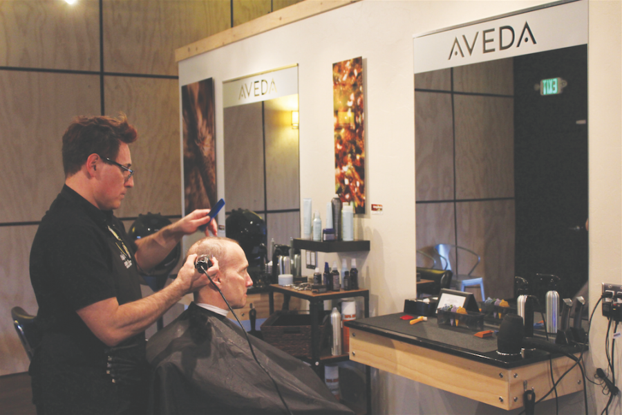Austin Maas | Rawr Hair stylist Michael Woodall trims the hair of his partner Will Butler at Canopy Aveda Salon, located in downtown Moscow.
