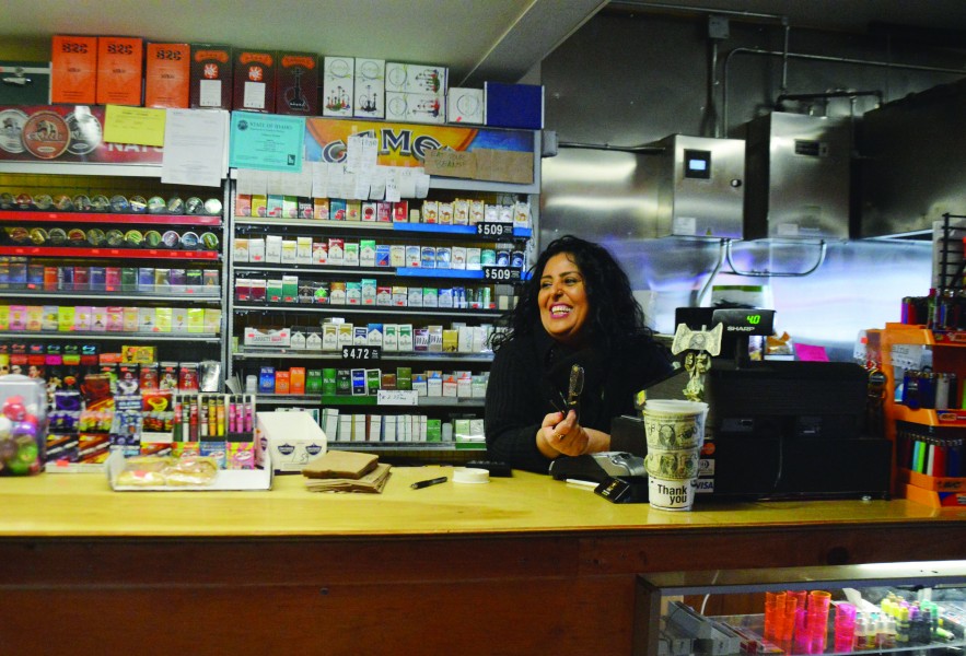 Alex Brizee | Rawr Farrukh Naz smiles as she interacts with students at her local business, The Perch.