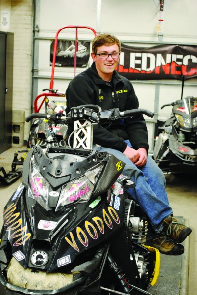 Joleen Evans | Argonaut Sophomore Zach Lipple shows off the clean snowmobile that went to competition.
