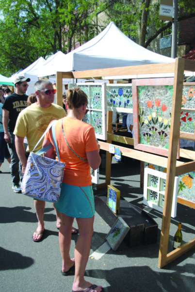 Joleen Evans | Argonaut Patrons browse a vendor's stand during the Farmer's Market in downtown Moscow.