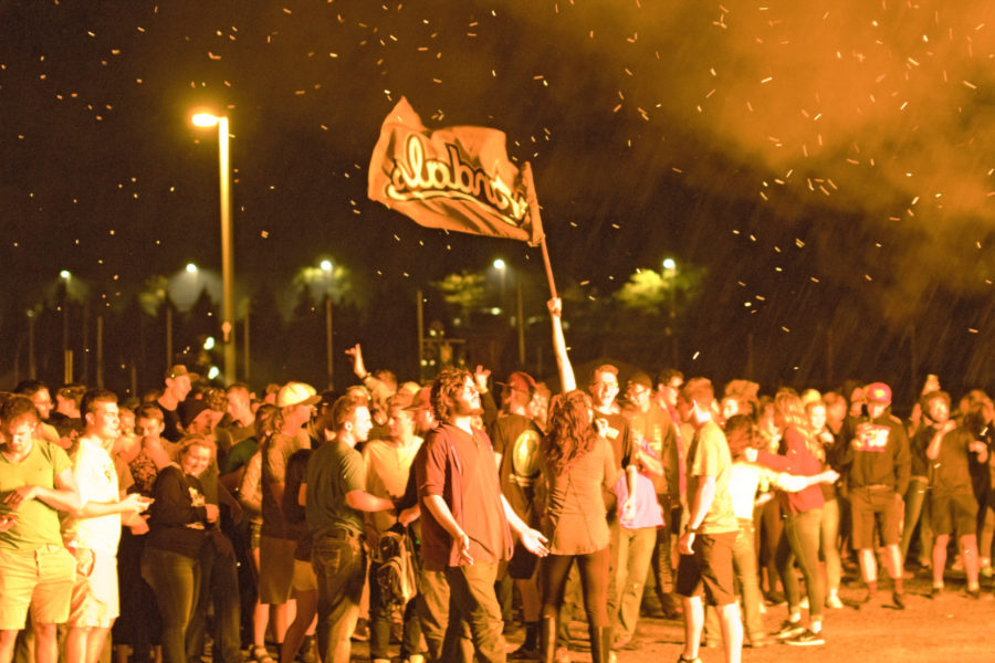 Connor Bunderson | Argonaut University of Idaho students socialize around the Bonfire as part of Homecoming Week Friday night after the announcement of Homecoming Royalty.  