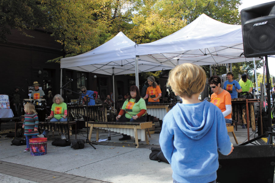 Diamond Koloski | Argonaut A boy watches as Sesitshaya Marimba performs at Friendship Square during the Farmer’s Market at noon on Saturday Sep. 24.