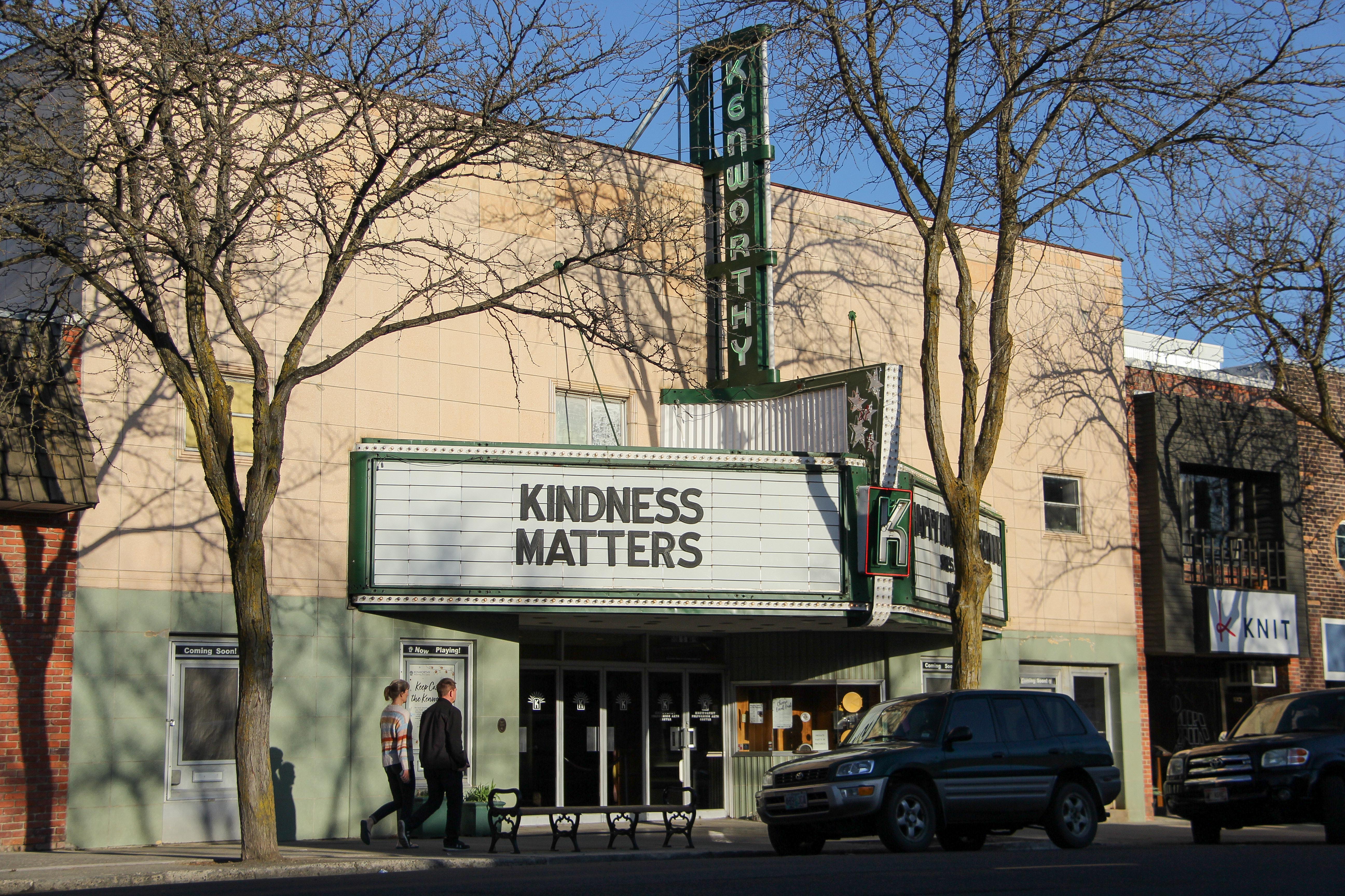 Two pedestrians walk past the Kenworthy Performing Arts Centre downtown | Hailee Mallett | Argonaut