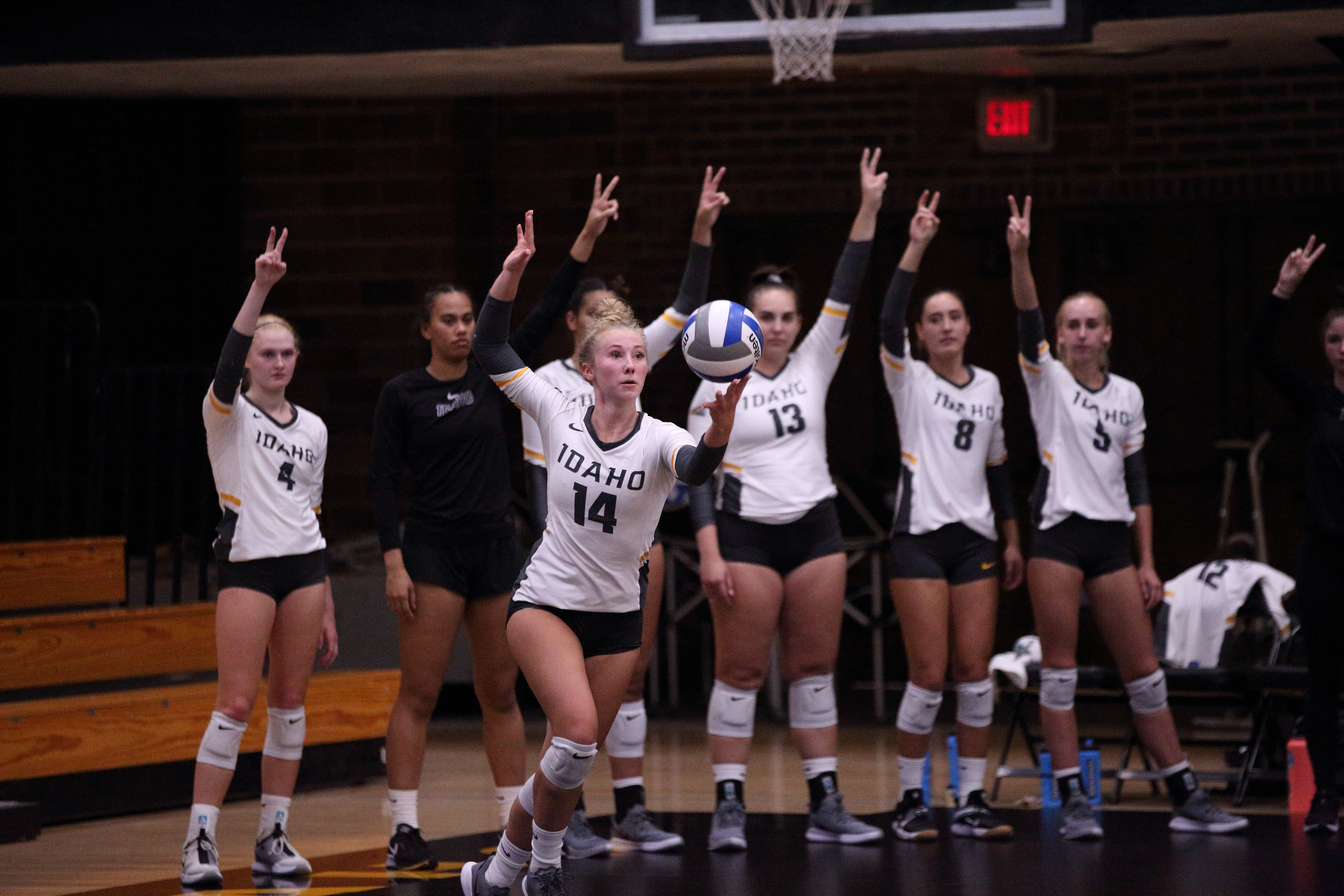 Redshirt sophomore setter Peyton Ely prepares goes to serve in front of her teammates on the sidelines during the game against Grand Canyon University on Aug. 28, 2021. Cody Roberts | Argonaut