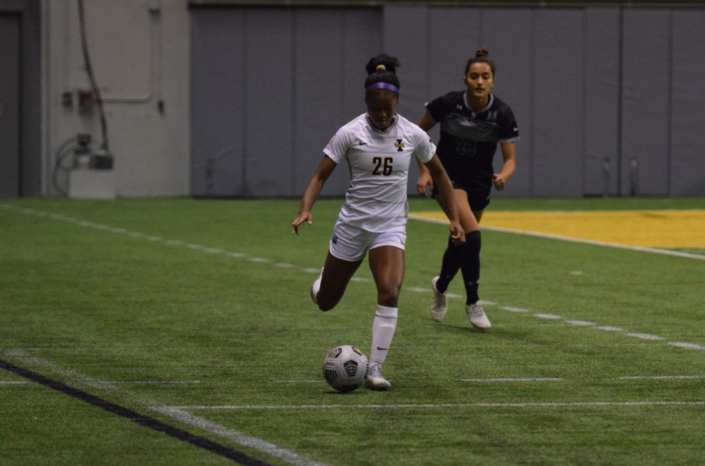 Sophomore Forward Jadyn Hanks brings the ball up the field and past a University of Hawaii defender on Sept. 8 in the Kibbie Dome.  Saydee Brass | Argonaut