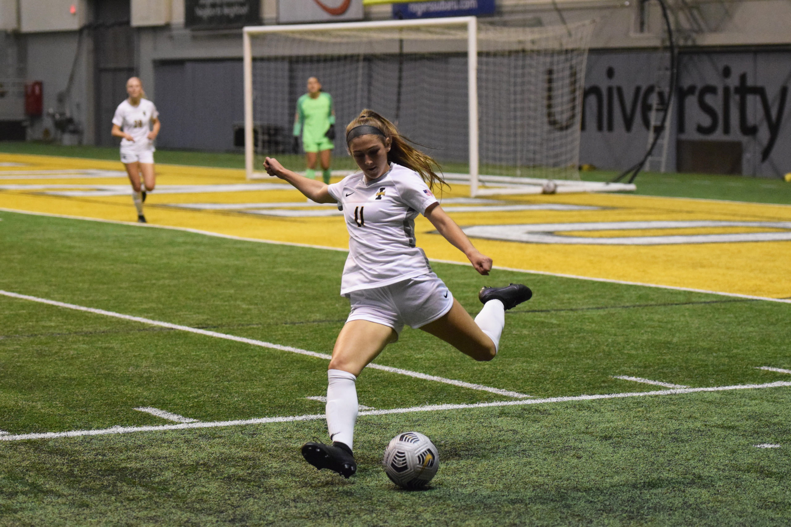 Sophomore defender Alyssa Peters kicks the ball upfield toward the University of Hawaii goal on Sept. 8 in the Kibboe Dome.  Saydee Brass | Argonaut