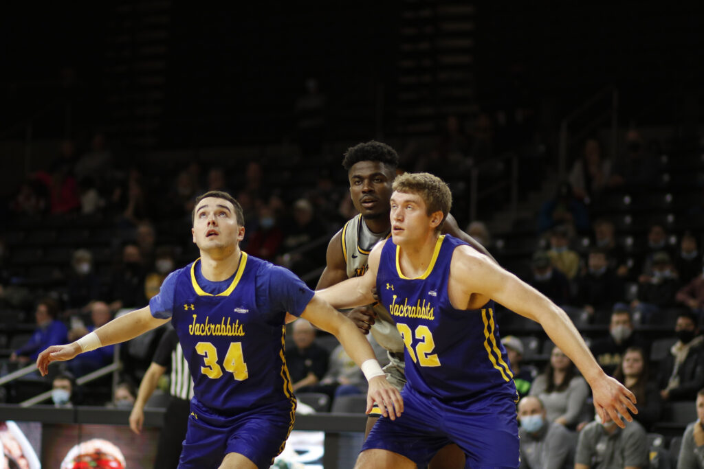 Junior forward Philip Pepple Jr. gets boxed out by two South Dakota State players on Dec. 8 in the ICCU Arena. Saydee Brass | Argonaut